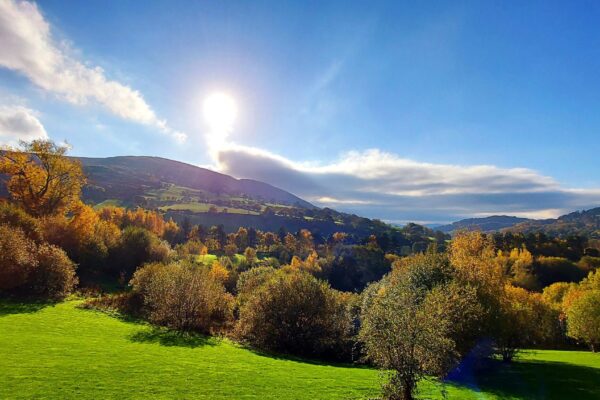 View for Maes Mynan Holiday Park of Moel Y Parc at the start of autumn | A living painting | North Wales Lodges For Sale