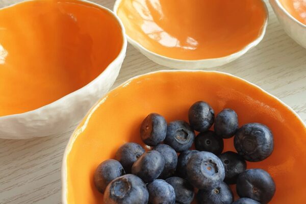 Bright orange ceramic bowls for warming soup this Autumn for your holiday home | Cosy interiors for your Holiday Retreat | North Wales