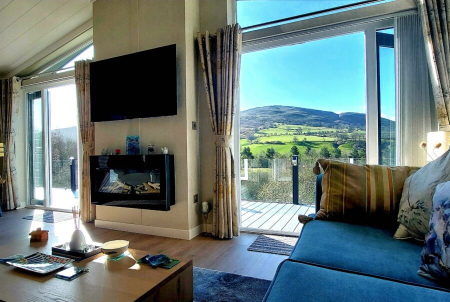 Interior image of Noor Lodge for sale on Maes Mynan Park in North Wales with stunning views from the lounge over the Clwydian Range.
