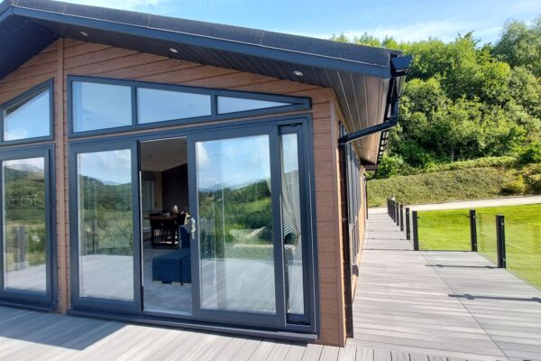 Exterior aspect of Carw Lodge | Bespoke luxury lodge for sale by Wessex Omar | Maes Mynan Park, North Wales