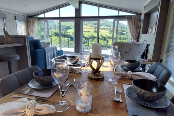Luxury Lodge for sale on Maes Mynan Park overlooking Clwydian Range | Countryside lake, hills and woodland views | Bespoke Luxury Lodge For Sale