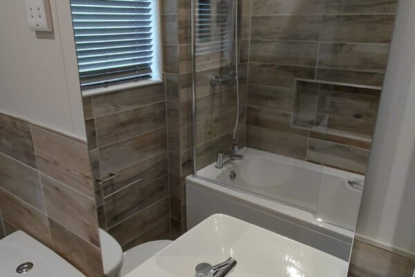 blue willow lodge at maes mynan park - family sized bathroom shower and bath