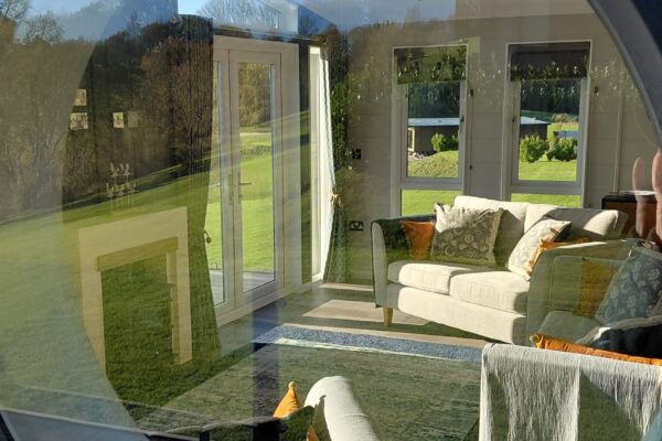 Luxury Lodge for sale - Through the round window - Blue Willow Lodge - Maes Mynan Park in North Wales