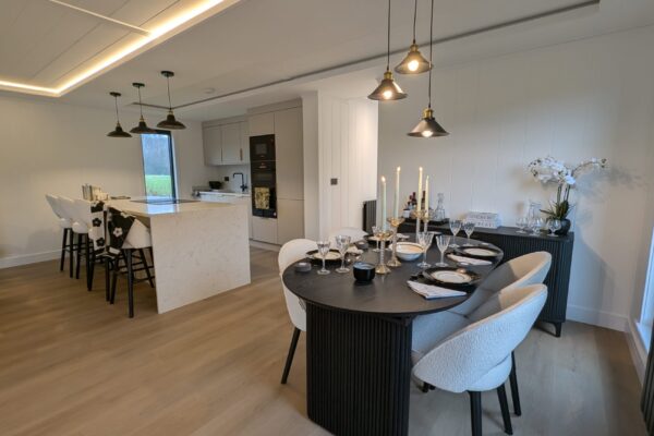 Open plan dining room in luxury lodge for sale by YourRetreats at Maes Mynan Park