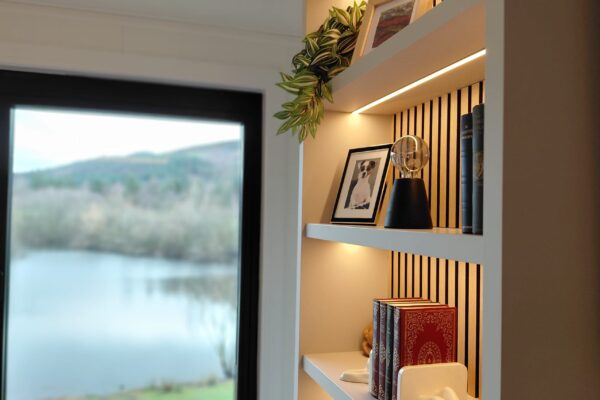 Open-plan living room in luxury lakeside lodge for sale