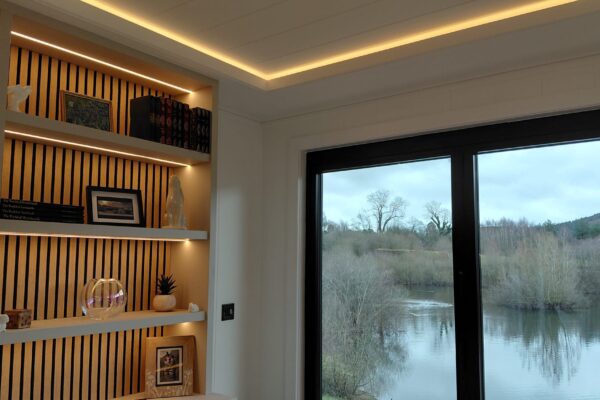 Lounge with lake views at Maes Mynan Park | Holiday Home For Sale | YourRetreats