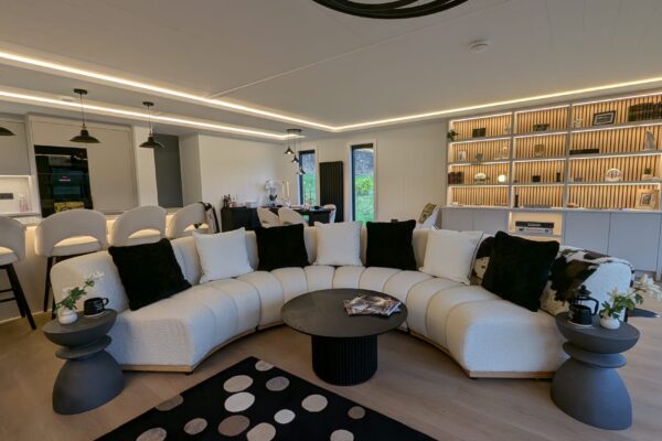 Open-plan living room in luxury lakeside lodge for sale