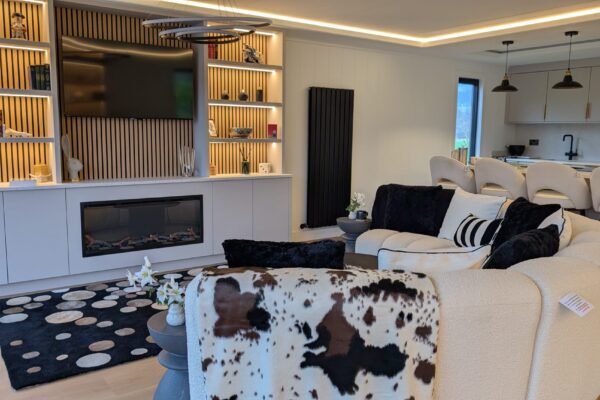 Built-in shelving and recessed TV in bespoke country holiday home